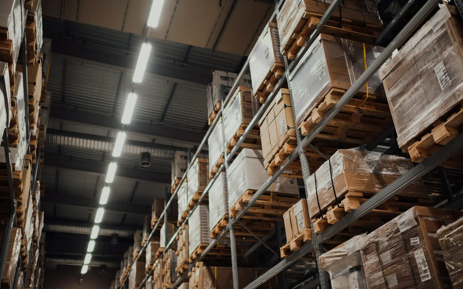 Cardboard cartons stacked on pallet racking in a warehouse
